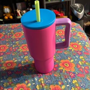 Vibrant Pink Tumbler with Blue Lid and Yellow Straw